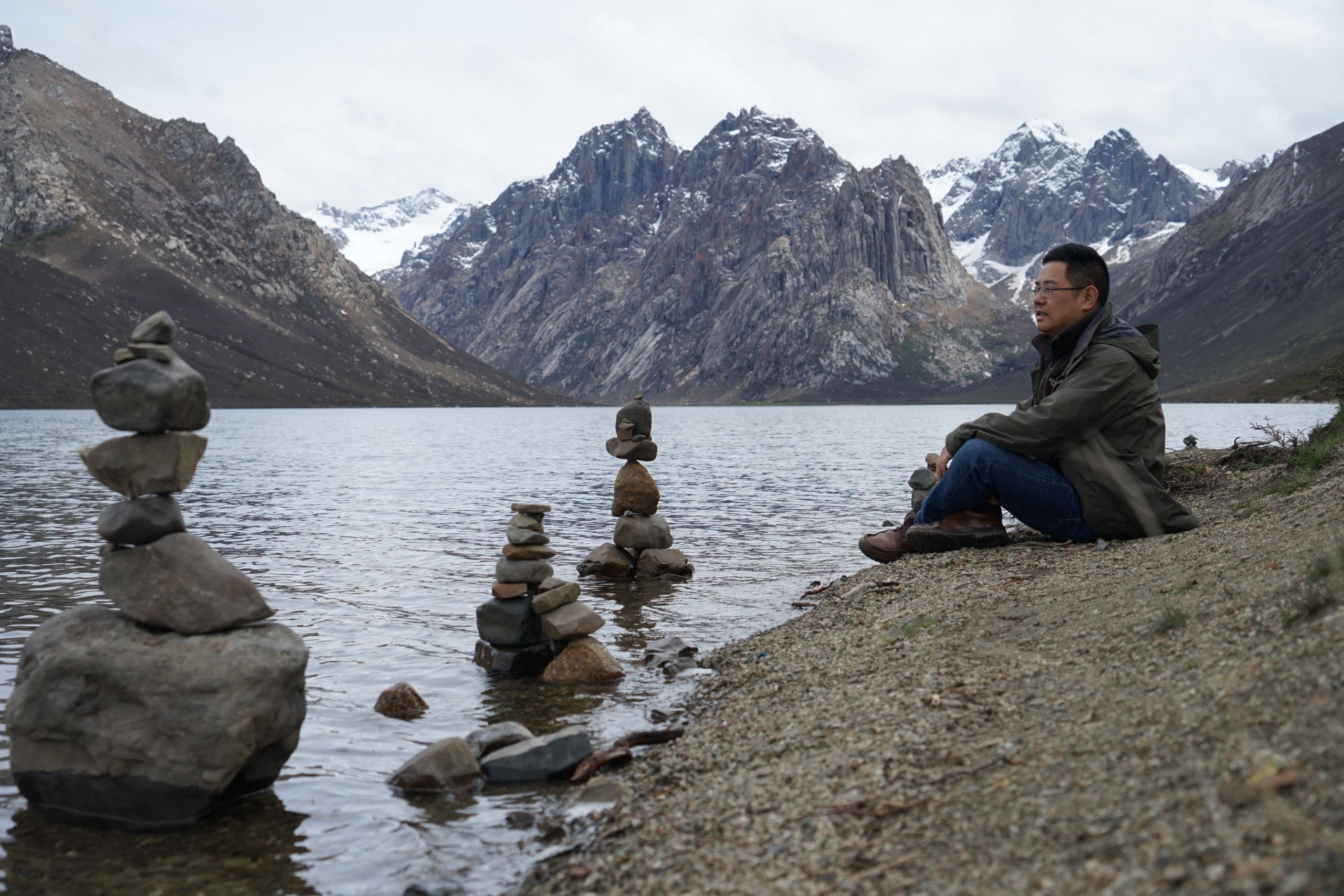 Prof Huai Chen, PhD, beside a glacial lake on the Tibetan Plateau