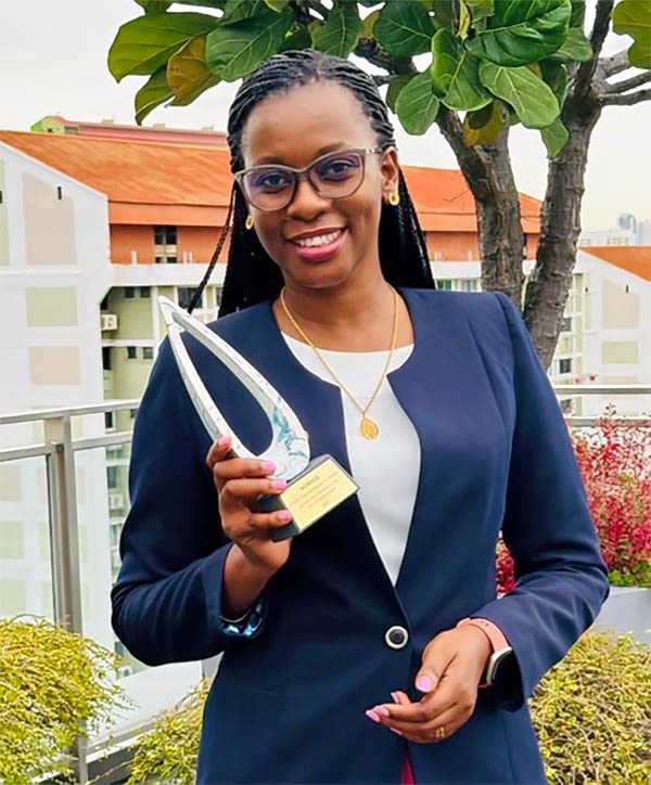 Dr Augustina Alexander with the 2024 OWSD-Elsevier Foundation Award for Early Career Women Scientists in the Developing World. 