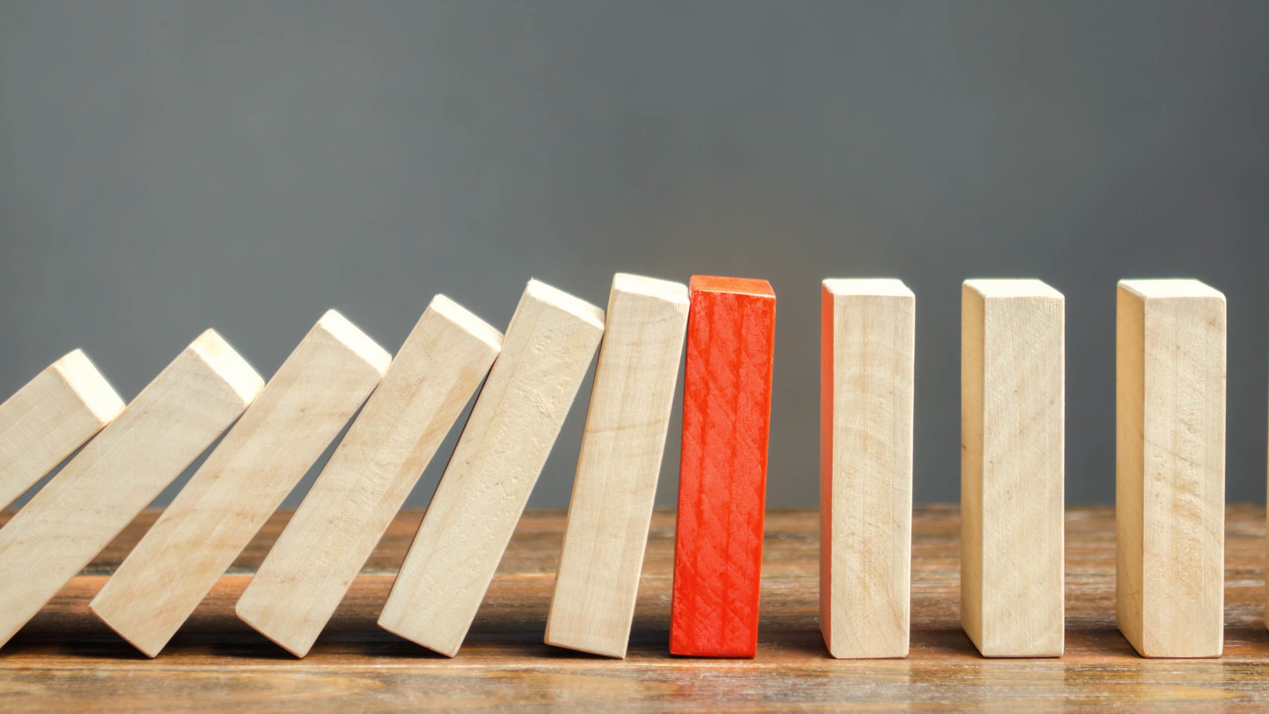 Dominoes depict the effect of risk. Source: Andrii Yalanskyi via iStock / Getty Images Plus