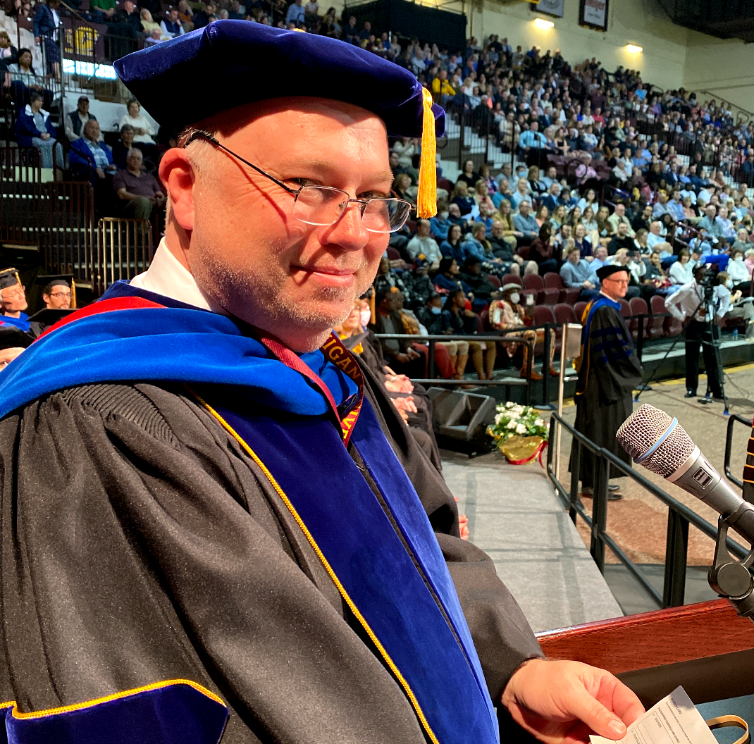 Dr David Weindorf, Vice President for Research and Innovation at Central Michigan University, speaks at a graduation ceremony.